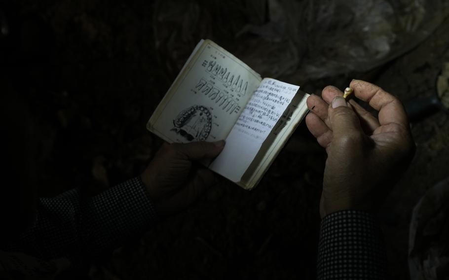 An Okinawan bone digger searches for remains from one of the fiercest ...