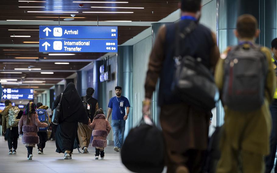 A handful of Afghan refugees are seen in an airport in the Philippines.