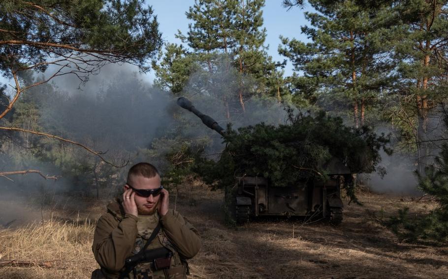 An undated image released on X by the Ukrainian Defense Ministry shows a service member holding his ears as an American-made Paladin self-propelled howitzer with the 93rd Mechanized Brigade fires in Ukraine. U.S. European Command failed to document the ways it validated and approved military aid for Ukraine following Russia’s February 2022 invasion, the Pentagon Inspector General found.