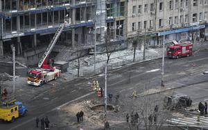 Firefighters work on the site of a damaged building after a Russian missile attack in Kyiv, Ukraine, Saturday, Jan. 18, 2025. (AP Photo/Efrem Lukatsky)