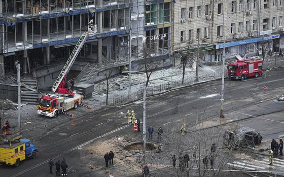 Firefighters work on the site of a damaged building after a Russian missile attack in Kyiv, Ukraine, Saturday, Jan. 18, 2025. (AP Photo/Efrem Lukatsky)