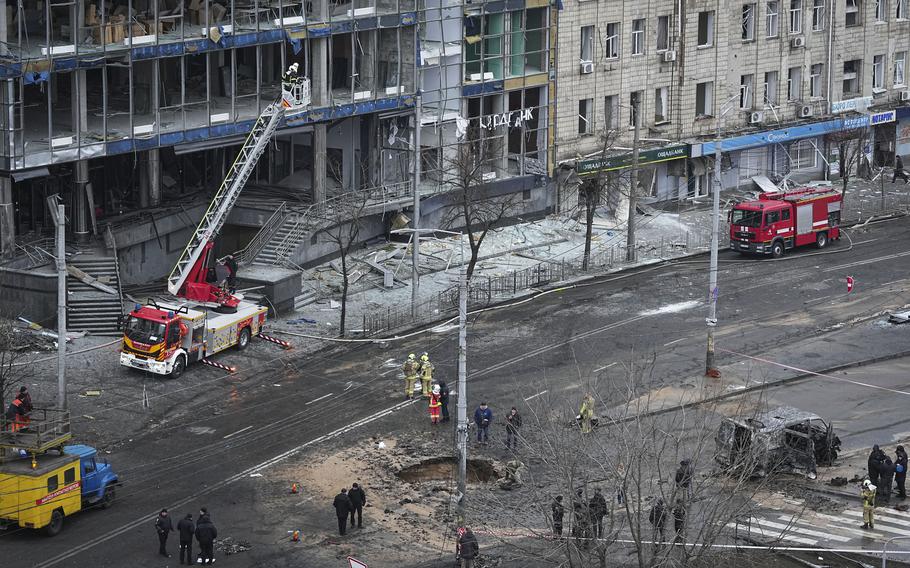 Firefighters work on the site of a damaged building after a Russian missile attack in Kyiv, Ukraine, Saturday, Jan. 18, 2025. 