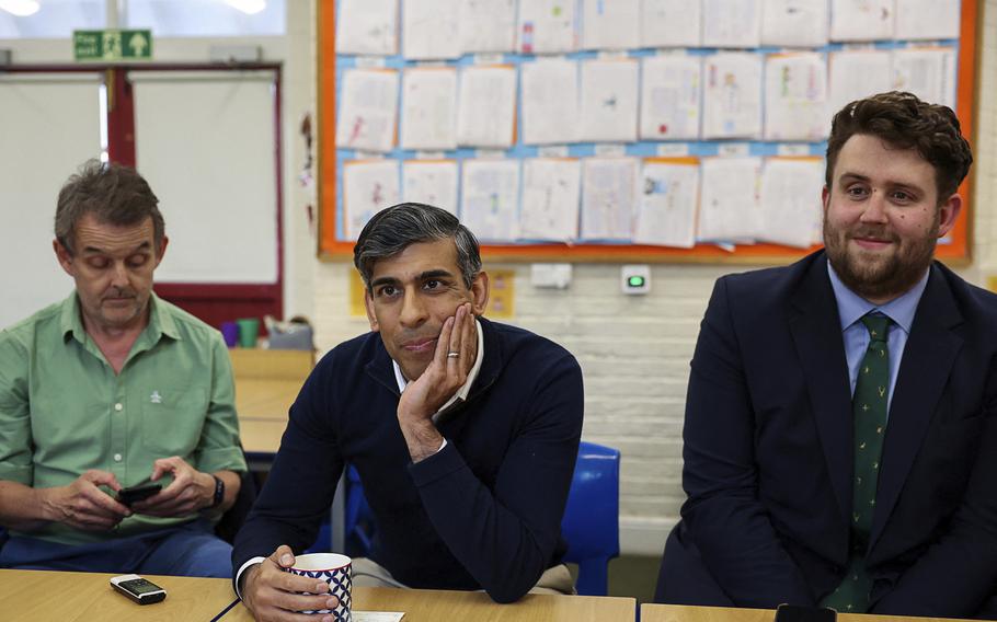 Britain's Prime Minister Rishi Sunak looks on as journalists ask him questions, during a visit to Braishfield primary school as part of a Conservative general election campaign event in Hampshire, England, Wednesday July 3, 2024. 