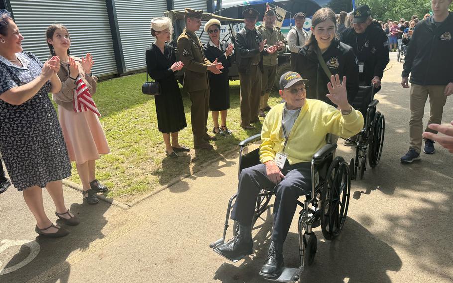 World War II veteran Clarence Holland waves to well-wishers in Houlgate, France, on Monday, June 3, 2024.