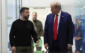 Donald Trump and Volodymyr Zelenskyy stand next to each other and speak.