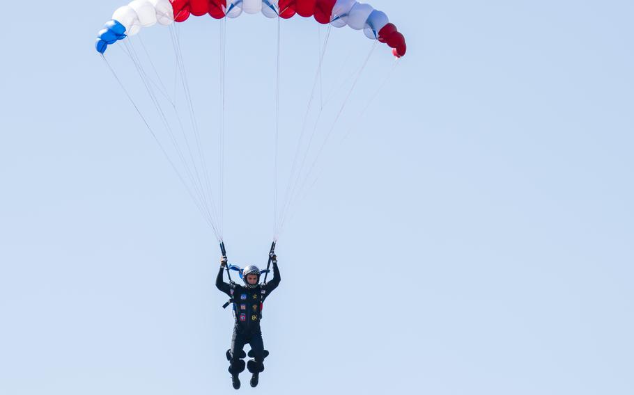 Sgt. 1st Class Michael Connors of the U.S. Army Parachute Team lands his parachute