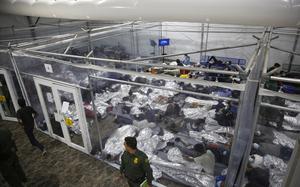 FILE - In this March 30, 2021, file photo, young minors lie inside a pod at the Donna Department of Homeland Security holding facility, the main detention center for unaccompanied children in the Rio Grande Valley run by U.S. Customs and Border Protection (CBP), in Donna, Texas. (AP Photo/Dario Lopez-Mills, Pool, File)