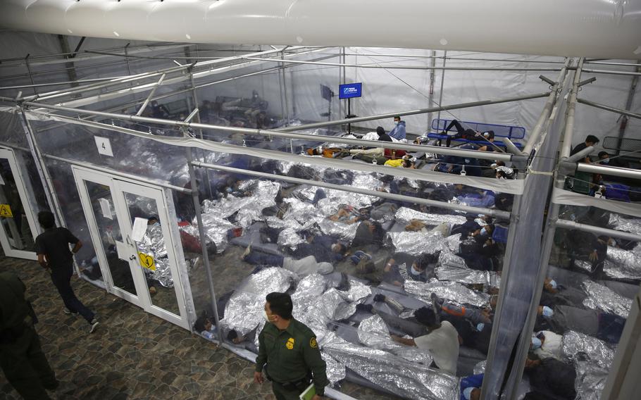 Youngsters like inside a containment area in a border holding facility.