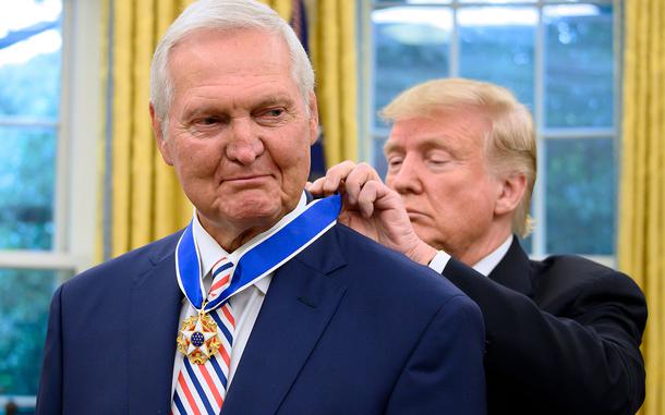 US President Donald Trump presents the Presidential Medal of Freedom to Los Angeles Lakers basketball legend Jerry Alan West in the Oval Office of the White House in Washington, D.C. on Sept. 5, 2019. (Jim Watson/AFP via Getty Images/TNS)