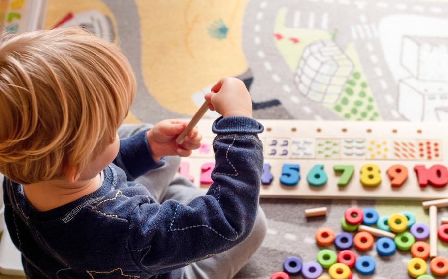 A child plays with toys.