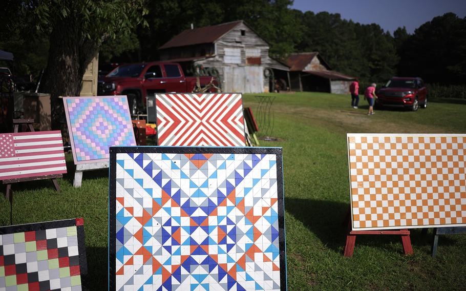 Barn quilts are displayed for sale during the U.S. 127 Yard Sale on Aug. 1 in Gadsden, Ala. 