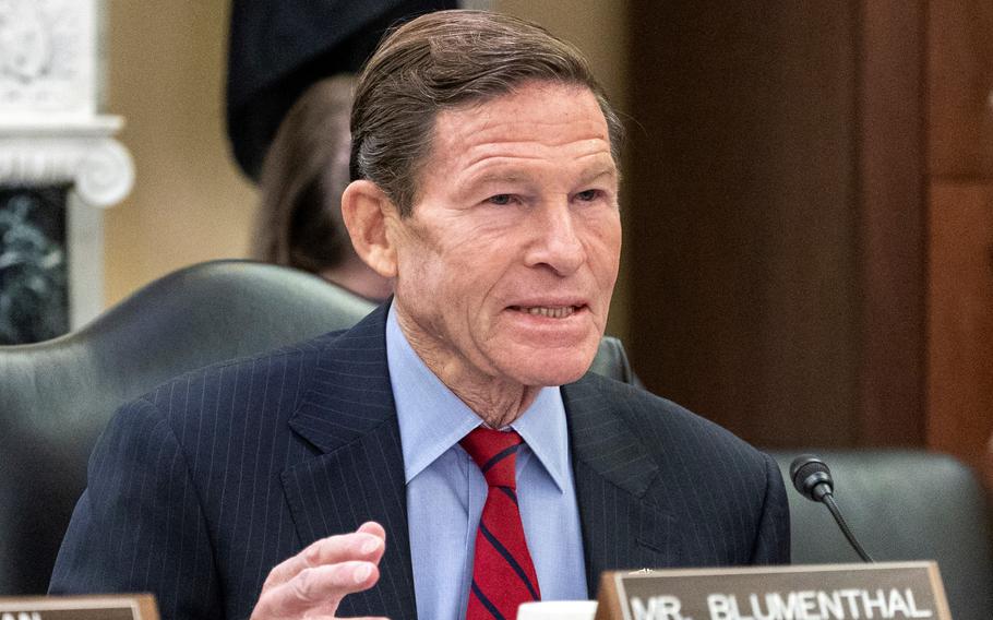 Blumenthal sitting and commenting during the hearing.