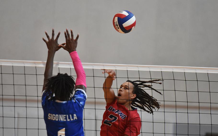 Aviano's Andrew Walker hits the ball past Sigonella's Robert Gibbons on Saturday, Oct. 5, 2024, at Aviano Air Base, Italy.