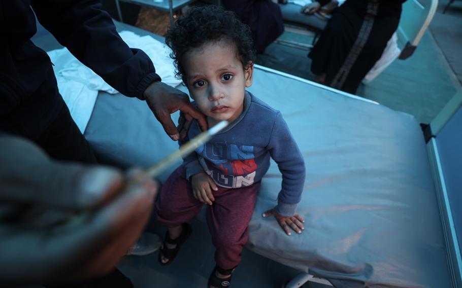 A sick child is attended to last week at Kuwaiti Hospital in Rafah. 