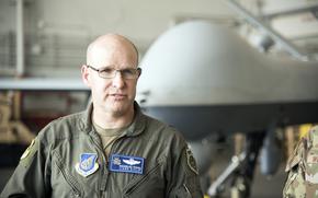 Brig. Gen. Nicholas Evans, commander of the 18th Wing, speaks with reporters inside a hangar at Kadena Air Base, Okinawa, March 21, 2025.