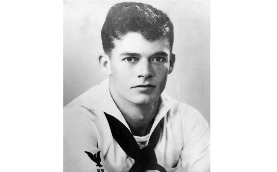 A black-and-white, World War II-era portrait of a Navy sailor in uniform.