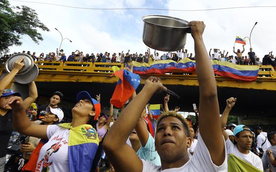 Demmonstrators bang on cooking pots and pans during a protest against Venezuelan President Nicolas Maduro's government in Valencia, Venezuela, on July 29, 2024.