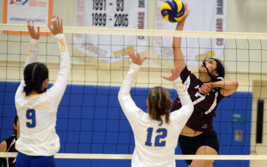 Matthew C. Perry's Raelin Reyes hits through the double block of Yokota's Kayla Bogdan and Erica Haas during Friday's DODEA-Japan girls volleyball match. The Samurai rallied from two sets down to win in five sets.
