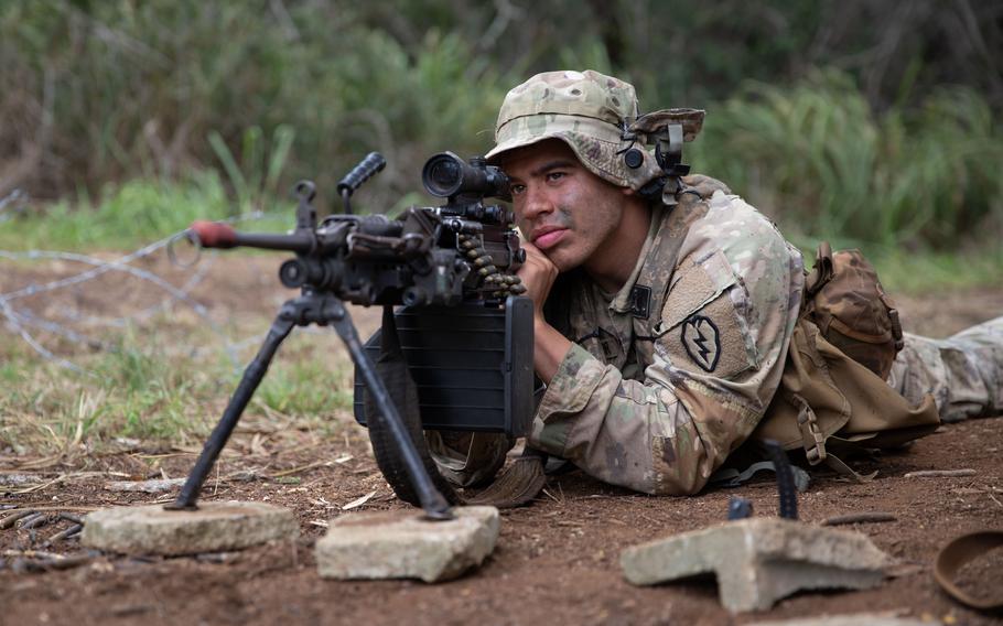 A soldier assigned to 3rd Infantry Brigade Combat Team, 25th Infantry Division pulls security at South Range on Schofield Barracks, Hawaii, during the Joint Pacific Multinational Readiness Center rotation in November 2023.