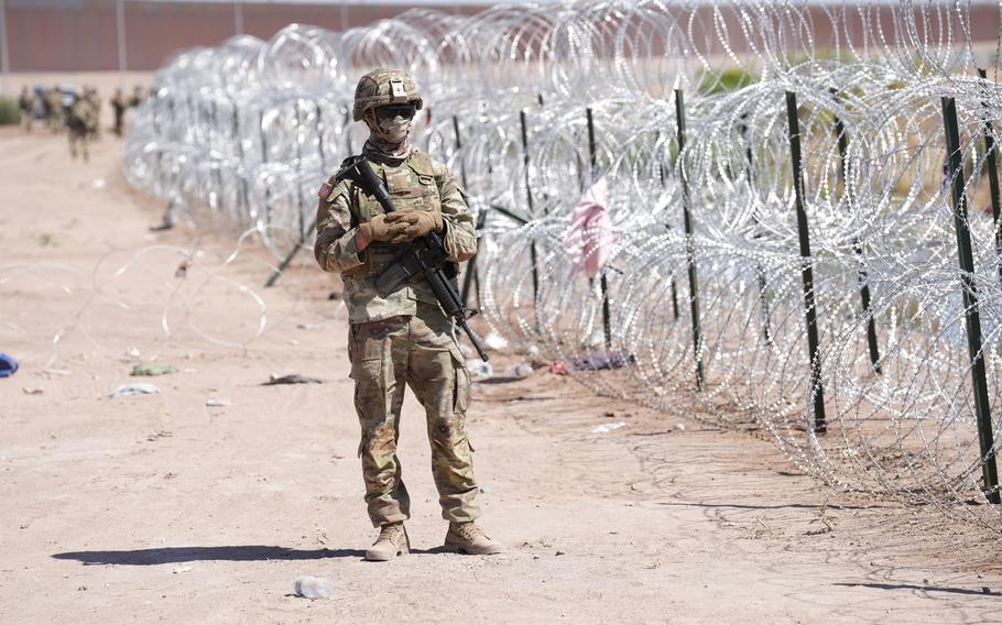 A photo of a soldier at the US Mexico border