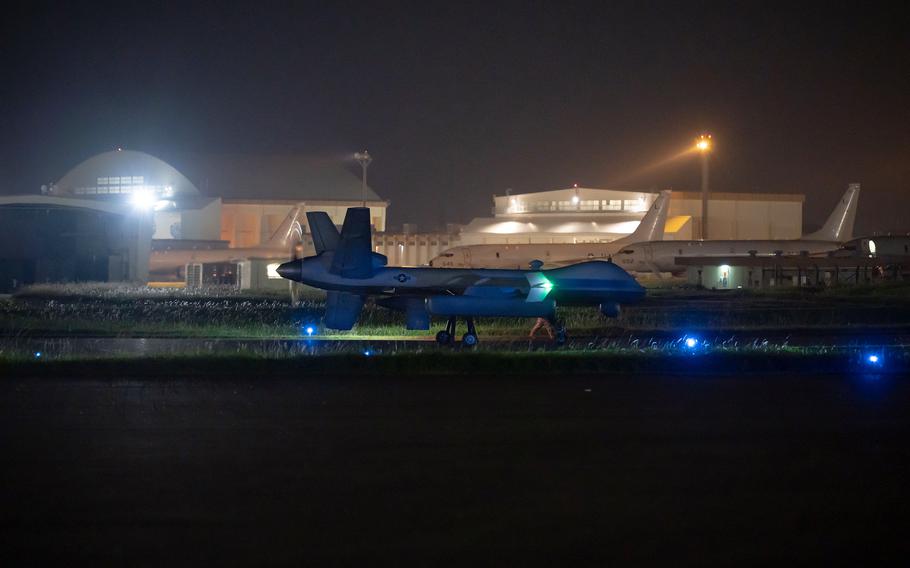 An MQ-9 Reaper taxis on the flightline at Kadena Air Base.