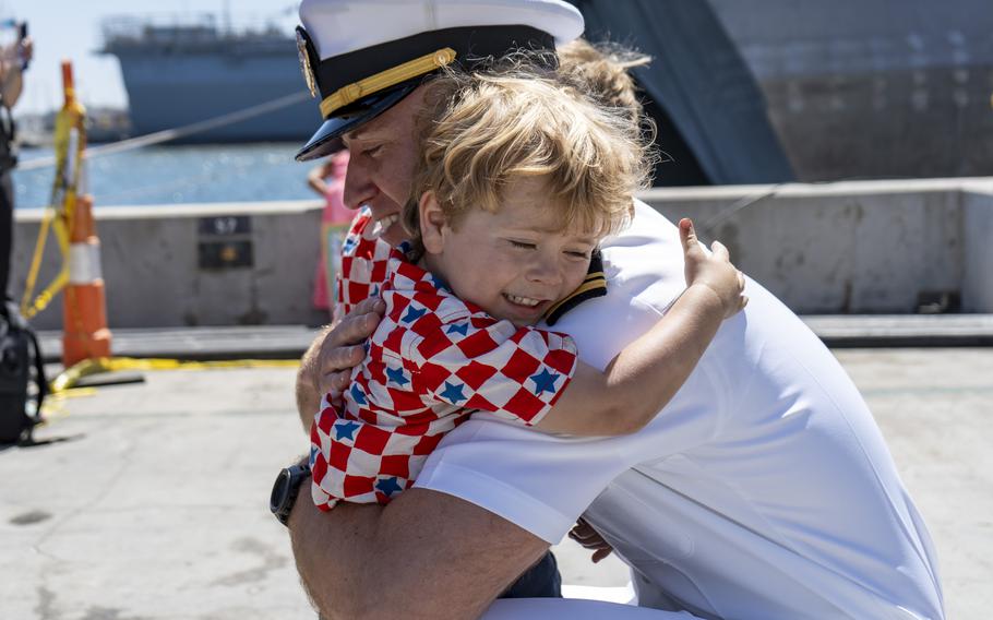 Lt. j.g. Michael Root greets a loved one 