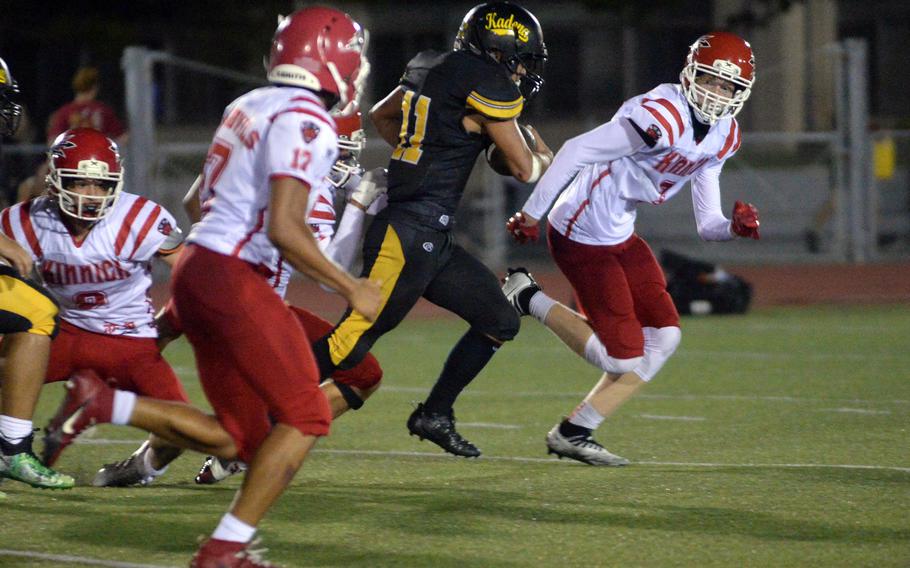 Kadena running back Hajime Reed (11) was tough to stop, rushing for 263 yards and a touchdown on 20 carries.