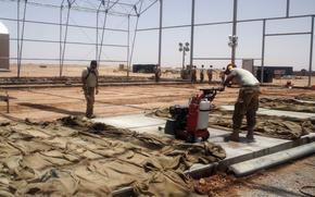 Airmen work on the drone apron at Air Base 201 in Agadez, Niger, in 2018. At the time, the base was touted as the largest U.S. Air Force-led construction project in history. The Defense Department said Aug. 5, 2024 that the withdrawal of troops from the base is complete. 