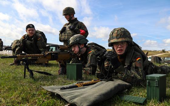 German soldiers fire a Heckler & Koch MG5/HK121 machine gun during a live fire exercise at Grafenwoehr Training Area, Germany, April 4, 2024. A majority of Germans support defense spending increases, according to a public opinion survey released Nov. 11, 2024.
