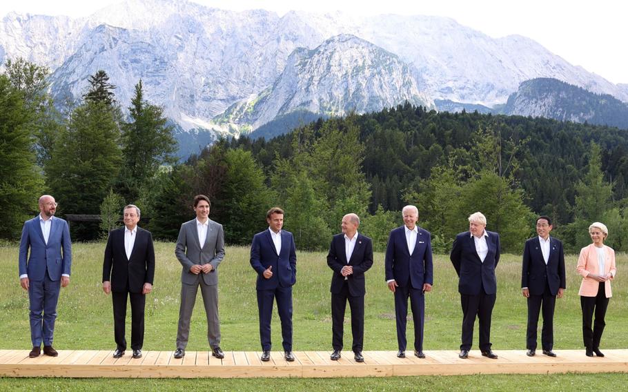 Michel, then-Italian Prime Minister Mario Draghi, Trudeau, Macron, Scholz, Biden, then-UK Prime Minister Boris Johnson, Kishida and von der Leyen at the family photo for the G-7 in Germany in June 2022. 