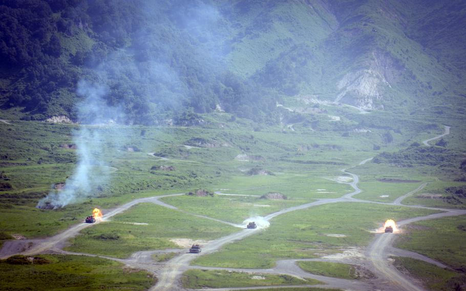 M1A2 Abrams tanks operated by the 1st Armored Brigade Combat Team, part of the 1st Armored Division from Fort Bliss, Texas, fire anti-tank rounds at the Rodriguez Live-Fire Complex in Pocheon, South Korea, Aug. 14, 2024. 