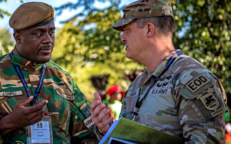Col. Matthew E. Kopp, security cooperation director for U.S. Army Southern European Task Force - Africa, speaks with Brig. Gen. Jethrow Chipili of Zambia during the African Land Forces Summit in Livingstone, Zambia, April 22, 2024. Kopp is wearing SETAF-AF's new patch with the added "Africa" bar.