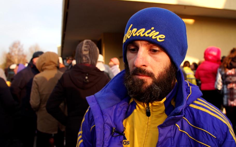 Oleksii Zvieriev, 35, waits to board a train to Kyiv at the Przemysl station. He is returning to Ukraine to fight in the war against Russia.