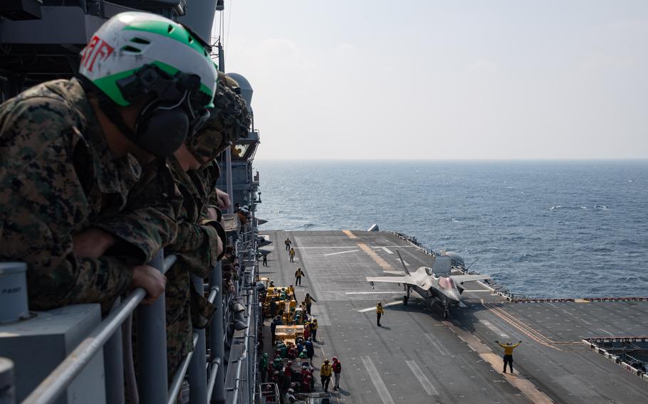 Sailors watch from above as an F-35B Lightning II taxis in the Philippine Sea on Monday, Feb. 17, 2025. 