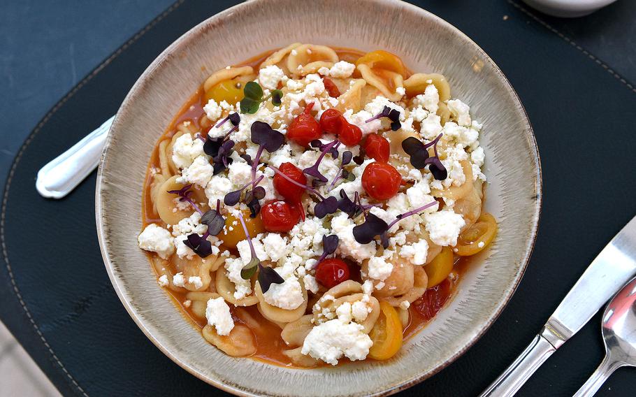 The fresh pasta with seasonal tomatoes and red berries at L'intuition in Houdeng-Aimeries, Belgium, comes with feta cheese made at a local dairy farm. The meal is a part of a restaurant's menu that is updated every month.