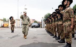 U.S. Army Gen. Christopher Cavoli, NATO's top military commander, salutes Italian soldiers at a July 1, 2024 ceremony in Solbiate Olona, Italy, where a new NATO quick reaction force was activated. 