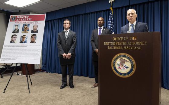 From right, Assistant Attorney General for National Security Matthew G. Olsen, speaks next to Erek L. Barron, US Attorney for the District of Maryland and William J. DelBagno, special agent in charge of the FBI Baltimore Field Office, during a news conference at the Office of the United States Attorney in Baltimore, Thursday, Sept. 5, 2024. (AP Photo/Stephanie Scarbrough)