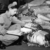 Unidentified air base,  Japan, Apr. 2, 1951:  Sgt. George K. Younce, Hickory, N.C., parachute specialist of the Far East Air Material Command (FEAMCOM) checks the chute as they come into FEAMCOM's speciallly equipped repair shops. FEAMCOM is charged with the inspection, repair and re-packing of parachutes used throughout the U.S. Far East Air Forces.

Looking for Stars and Stripes’ historic coverage? Subscribe to Stars and Stripes’ historic newspaper archive! We have digitized our 1948-1999 European and Pacific editions, as well as several of our WWII editions and made them available online through https://starsandstripes.newspaperarchive.com/

META TAGS: Pacific; Japan; U.S. Air Force; military supplies; Korean War; Far East Air Material Command; FEAMCOM; servicemember; airman