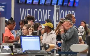 Passengers seek assistance at Delta ticket counters at Hartsfield-Jackson International Airport on Wednesday, July 24, 2024. (John Spink/The Atlanta Journal-Constitution/TNS)