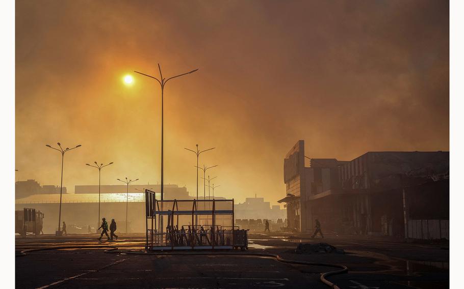 Firefighters work at a site of a household item shopping mall hit by a Russian air strike, amid Russia’s attack on Ukraine, in Kharkiv, Ukraine May 25, 2024.