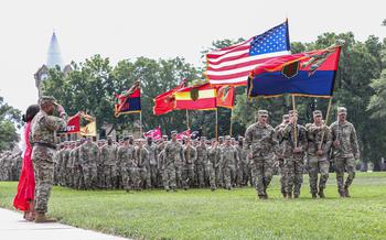 Maj. Gen. Monté  L. Rone salutes the colors during pass in review on Cavalry Parade Field, Fort Riley, Kansas, on June 28, 2024. Maj. Gen. Rone is taking command of the 1st Infantry Division.