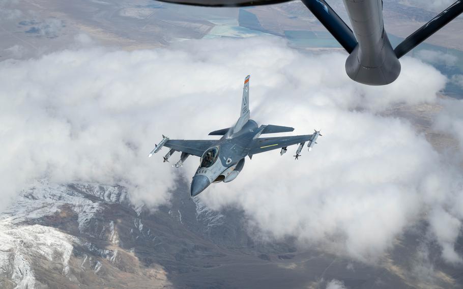 An aircraft departs after aerial refueling