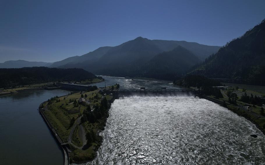 Water spills over the Bonneville Dam on the Columbia River, which runs along the Washington and Oregon state line, on Tuesday, June 21, 2022. The U.S. government on Tuesday, June 18, 2024, acknowledged for the first time the harms that the construction and operation of dams on the Columbia and Snake rivers in the Pacific Northwest have caused Native American tribes, issuing a report that details how the unprecedented structures devastated salmon runs, inundated villages and burial grounds, and continue to severely curtail the tribes' ability to exercise their treaty fishing rights. 