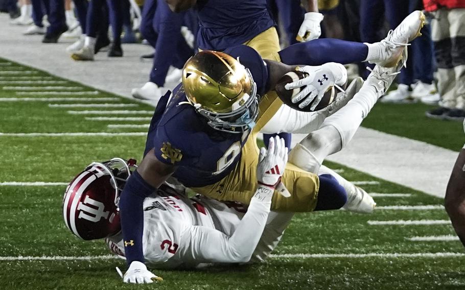 Jayden Thomas holds onto the ball.