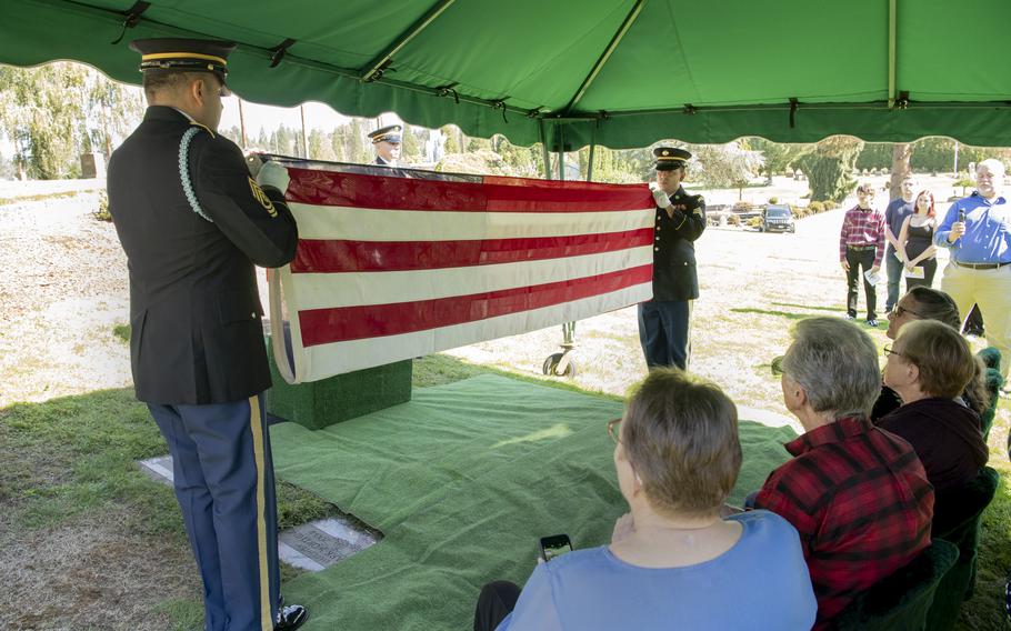 Oregon Army National Guard Funeral Honors members conduct a flag folding ceremony to honor U.S. Army Pvt. Billy E. Calkins