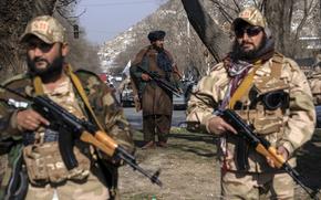 FILE - Taliban fighters stand guard in Kabul, Afghanistan, on Dec. 26, 2022. (AP Photo/Ebrahim Noroozi, File)