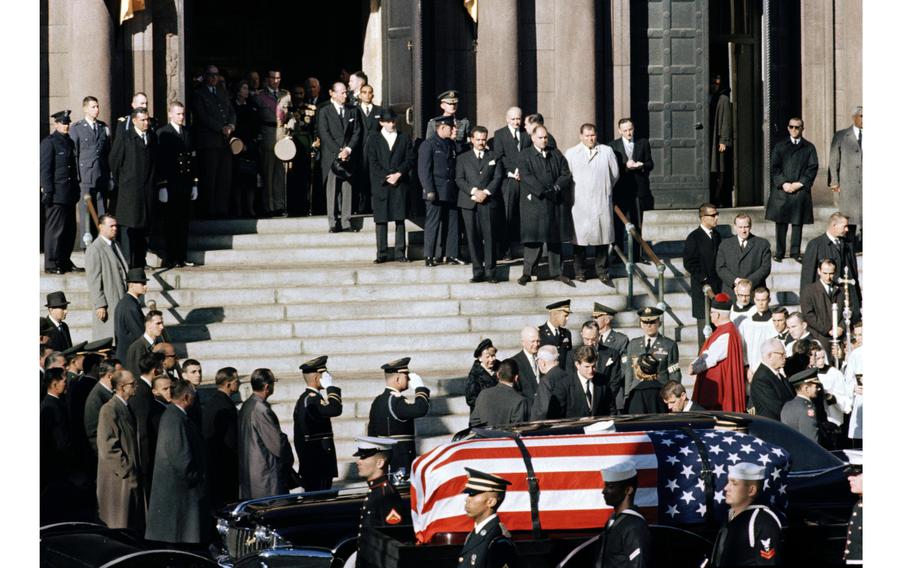 President John F. Kennedy’s coffin is covered by an American flag outside the National Cathedral in Washington.