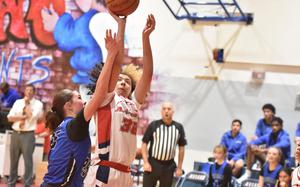 Aviano's Gabriella Fortuna puts up a shot while being fouled by Rota's  Carl Jacobs in the Saints' 58-32 victory Friday, Jan. 10, 2025, at Aviano Air Base, Italy.

Kent Harris/Stars and Stripes