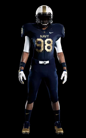 A Navy player wearing a uniform with an all-deep blue jersey/pants combo with gold numbers and white helmet.