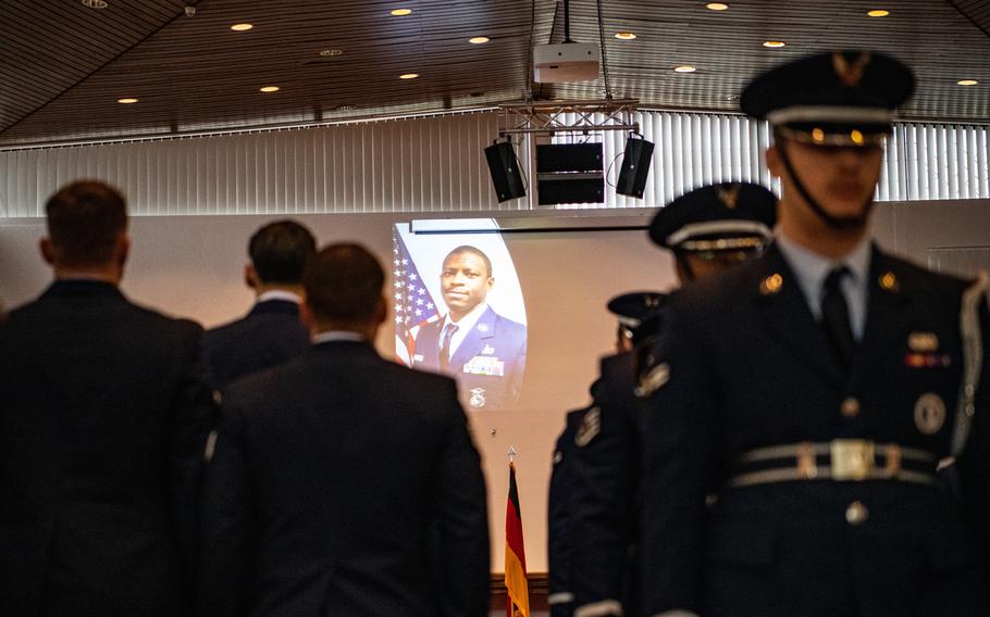 A portrait of Air Force Tech. Sgt. Lionel Rhone Jr. is projected onto a wall of the Northside Chapel at Ramstein Air Base in Germany on Nov. 27, 2023. Airmen held a memorial for Rhone, who died last month after a motorcycle crash near the base.